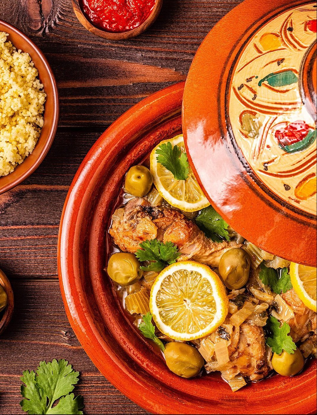 Traditional moroccan tajine of chicken with salted lemons, olives. Top view. T4KM3D Traditional moroccan tajine of chicken with salted lemons, olives. Top view.